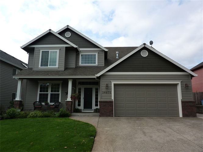 Freshly repainted home exterior with clean siding